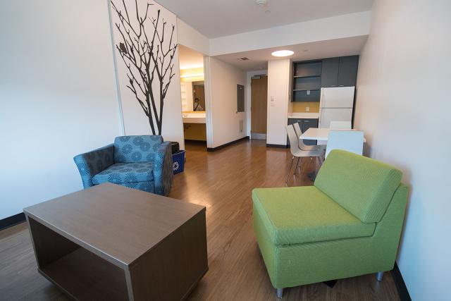 A student suite in University Hall that features open communal space, with a shared living room and kitchenette.
